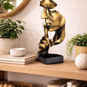 Sculpture en or et noir silencieuse